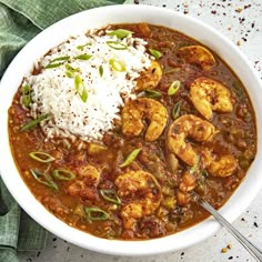 a white bowl filled with food and rice