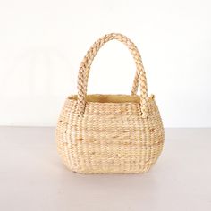 Unveil the charm and elegance of our high-quality, beautifully handcrafted Straw Weave Handbags, perfect for beach outings, shopping trips, and everyday use. Measurements : Height : 15 cm. / 6 inches Width : 20 cm. / 8 inches Depth : 10 cm. / 4 inches ✨ Explore Our Collection: Discover the latest styles of popular handbags, each thoughtfully designed to be both functional and fashionable. Handcrafted by talented local artists in Thailand, our Straw Weave Handbags are made from sustainable water hyacinth, ensuring durability and eco-friendliness. 💖 Why Choose Our Handbags: Artisanal Excellence: The exquisite craftsmanship and attention to detail make each bag unique and one-of-a-kind. Created with love and care, our handbags reflect the skill and dedication of our artisans. Versatile Style Natural Straw Bag With Rolled Round Handles, Elegant Basket Straw Bag With Rolled Handles, Elegant Handwoven Straw Market Bag, Elegant Handwoven Straw Bag For Market, Elegant Handwoven Straw Bag For The Market, Handwoven Natural Bags For Picnic, Picnic Basket Bag With Braided Handles, Elegant Natural Crochet Basket Bag, Natural Basket Shoulder Bag For Picnic