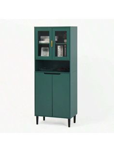 a green cabinet with two doors on the front and one door open to reveal an electronic device