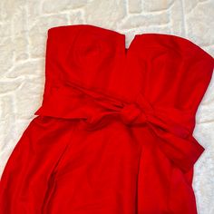 Beautiful Red Dress Brand New, With Tags True To Size Tall Length Brand New, With Tag Perfect For Your Upcoming Holiday Events Smoke Free Home Fitted Holiday Dress With Bow Detail, Red Fitted Dress With Sashes, Fitted Red Dresses With Sashes, Chic Red Mini Dress With Bow, Holiday Fitted Strapless Dress, Holiday Strapless Fitted Dress, Red Sleeveless Dress With Bow, Strapless Fitted Holiday Dress, Chic Red Strapless Dress With Sweetheart Neckline