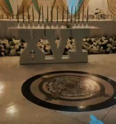 an image of the inside of a church with candles and decorations on display in it