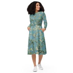 Meet your new favorite dress! Its soft fabric and flattering cut will ensure you feel comfortable and feminine all day long. Plus, the fitted waist and flared bottom part of the dress will accentuate the wearer's naturally beautiful silhouette. The best part about the dress? It. Has. Pockets.   * 95% polyester, 5% elastane (fabric composition may vary by 1%)  * Premium knit mid-weight jersey fabric  * Midi length  * Long sleeves  * Side pockets  * Boat neckline  * Fitted on the waist  * Flared bottom part This product is made custom and specially for you as soon as you place an order, which is why it takes us a bit longer to deliver it to you as well as why we can not accept returns. Making products on demand instead of in bulk helps reduce overproduction, so thank you for making thoughtfu Modest Long Sleeve Flowy Midi Dress, Spring Long Sleeve Midi Dress, Long Sleeve Floral Print Maxi Dress In Relaxed Fit, Long Sleeve Floral Print Relaxed Fit Dress, Long Sleeve Relaxed Fit Floral Print Dress, Long Sleeve Relaxed Fit Dress With Floral Print, Flowy Long Sleeve Midi Dress With Floral Print, Flowy Long Sleeve Dress For Spring, Flowy Long Sleeve Floral Midi Dress