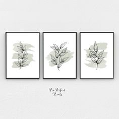 three black and white prints with leaves on them