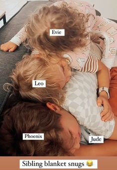 two young children laying on top of each other with names in front of their faces