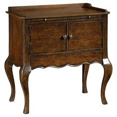 an antique wooden cabinet with two drawers and one door on the bottom shelf, is shown