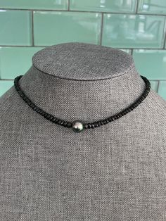 This black on black choker is a true showstopper. I've chosen one beautiful 9mm Tahitian black pearl, AAA/AA quality, and paired it with hand matched graduated 3-5mm black Tourmaline faceted rondelles to make a choker that is a black lover's dream. The Tahitian pearl is a genuine South Sea pearl imported from Tahiti and has not been dyed or colored in any way. The pearl is truly the center of attention in this piece but the inky opaque black schorl Tourmaline rondelles aren't exactly wallflowers Schorl Tourmaline, Goth Choker, Choker Black, Black Pearl Necklace, Chosen One, Solitaire Necklace, Tahitian Black Pearls, Sea Pearl, Black Choker