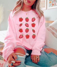 Strawberry Top, Strawberry Print, Preppy Sweatshirt, Fruit Sweatshirt, Cottage Core Crewneck, Strawberries Sweater, Strawberry Gifts, Cottagecore Sweater, Strawberry Top, Strawberry Clothes, Botanical Sweatshirt  This cute strawberry sweater will keep you cozy throughout the year. Any strawberry lover would appreciate this sweatshirt. 🤩 TIP: These run true to size. If you want an oversized look, size up 2-3 sizes. 😉 Gildan Unisex Sweatshirt: -50% Cotton 50% Polyester - Medium-heavy fabric (8.0 oz/yd² (271.25 g/m - Loose fit - Sewn-in label - Runs true to size ✅Design Printing Design printed using Direct to Garment (DTG) print technology. ✅ Care Instructions Due to the ink used in the design, please wash it inside out in cold water. Allow the item to air dry for lasting print quality. ✅ P Strawberry Sweatshirt, Strawberry Clothing, Fruit Clothing, Strawberry Sweater, Strawberry Aesthetic, Foodie Outfit, Preppy Mode, Cottagecore Sweater, Soft Girl Era