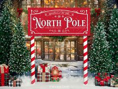 the north pole sign is surrounded by christmas trees