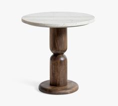 a white marble top table with wooden base