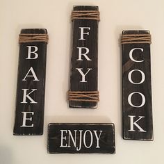 three wooden signs that say bakery and enjoy