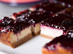 blueberry cheesecake cut into slices on a plate