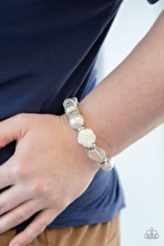 A collection of silver, pearly white, and white crystal-like beads are threaded along a stretchy band around the wrist. A shiny white resin rose joins the refined palette for a glamorous finish.

 Sold as one individual bracelet. Resin Rose, Necklaces Women, Rose Crystal, White Bracelet, Box Accessories, White Bracelets, Silver Frames, Paparazzi Accessories, Rock Stars