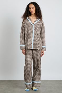 Our Antonia pyjama set, redesigned in brown gingham with baby blue trims. Made from 100% organic cotton, offering maximum cosiness with minimal impact. • Top and bottoms • Matching bag included • Matching eye mask available • Button-down front • Chest pocket • Elasticated waist with functional tie • 100% organic cotton • Designed in London MODEL INFO: Model is 5'10 and is wearing a UK 8. Crochet Stripe Scarf, Luxury Pyjamas, Ballet Outfits, Damson Madder, Brown Gingham, London Models, 2024 Wishlist, Xmas List, Checked Scarf