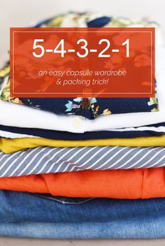 a stack of folded clothes with the text, 5 - 432 - 21 an easy capsule wardrobe & packing trick