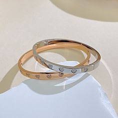 Pattern: Heart Shape Occasion: Daily Color: Rose Gold, White Quantity: 1 Piece Material: Titanium Steel Gender: Women's Design: Inlay Classification: Bangle Style: French Style, Simple Style Inlay Material: Zircon Weight: 22g Elegant Alloy Heart Bracelet, Valentine's Day Stainless Steel Bangle, Stainless Steel Bangle Bracelet For Valentine's Day, Rose Gold Metal Heart Bangle Bracelet, Rose Gold Metal Heart Bangle, Rose Gold Heart Bangle Bracelet, Elegant Stainless Steel Bracelets For Valentine's Day, Valentine's Day Rose Gold Heart Bangle Bracelet, Heart-shaped Stainless Steel Bracelets For Weddings