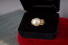 vintage 10K yellow gold + Mabe' pearl ring.  Bold claw design with iridescent large cabochon pearl center.  Circa 1980s.  Size 8.5.   Signed, 10K, CID (jewelry artist, Clyde Duneier) very good vintage, preowned condition.  This is a solid gold ring with natural gemstone, not a reproduction or reissue.   Please ask questions before purchasing, all sales are final. Classic Cabochon Pearl Ring For Formal Occasions, Classic Formal Pearl Ring With Cabochon, Formal Pearl Ring Jewelry, Heirloom Pearl Jewelry For Formal Occasions, Vintage Pearl Ring As Gift, Vintage Pearl Rings As Gift, Vintage Pearl Ring For Formal Occasions, Vintage Round Pearl Jewelry, Vintage Oval Pearl Jewelry