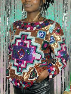 "CRAZY sequined top flashing a funky, psychedelic geometric pattern.  Condition: 7/10, some wear. Missing sequins but hardly noticeable. See last photos. Best Fits: Medium  (Model is 5'5\" and typically wears a size 6 or S)  Measurements: Shoulder: 17\" Sleeve: 21\" Arms Eye: 9.5\" Sleeve Opening: 5\" Neck Opening: 13.5\" Bust: 20\" Waist: 20\" Hip: 20\" Total Length: 23\" ** All measurements are taken with garment lying flat. Please carefully check our measurements against your own measurements Sequin Pattern, Fun Outfits, Sequined Top, Sequin Top, Saint Louis, Top Pattern, Sweater Outfits, Gender Neutral, Cool Outfits