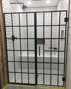 a jail cell with a tub and tiled floor