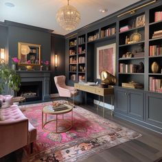 a living room filled with lots of furniture and bookshelves