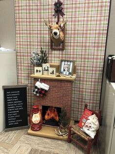 DIY cardboard fireplace with Christmas decor. Office cubicle. Log Cabin Cubicle Decoration, Christmas Desk Decor Ideas Office Cubicle, Christmas Cubicle Ideas, Cubical Christmas Decorations Ideas, Cubical Christmas Decorations, Cubicle Christmas Decor, Diy Cardboard Fireplace, Desk Decor Ideas Office Cubicle, Christmas Decor Office