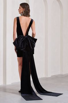 the back of a woman's black dress