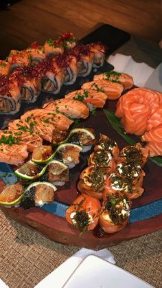 sushi platter with various types of sashimi on it