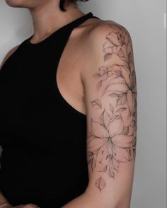 a woman with a tattoo on her arm