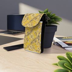 Yellow Floral Bandanna Illustration Pattern Crossbody Cell Phone Wallet Purse. This crossbody shoulder bag is compact and adds a splash of style. It comes in one size (7.5" x 4.9") and features an extendable faux leather strap (29.6" to 51.2"). Two main compartments have a flip-up cover—one for a phone and three hidden ones for regular size cards. Made from high-grade microfiber leather. .: Material: 100% high-grade faux leather .: One size: 7.5" × 4.9" × 1" (19cm × 12.5cm × 2.5cm) .: Detachable, adjustable faux leather strap (29.6" to 51.2" (75cm to 130cm)) .: 2 main flip-up compartments with 1 pocket and 3 hidden card slots .: Black microfiber leather back .: Lightweight and compact Everyday Yellow Shoulder Phone Bag, Yellow Crossbody Bag With Cell Phone Pocket, Affordable Yellow Rectangular Phone Bag, Cheap Yellow Rectangular Phone Bag, Yellow Mobile Phone Bag, Rectangular, Cell Phone Wallet, Phone Wallet, Yellow Floral, Leather Material