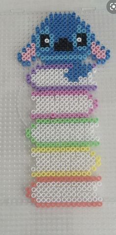 a cross stitch bead pattern with an image of a cartoon character in the middle