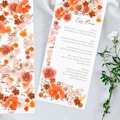 two cards with flowers on them sitting next to each other