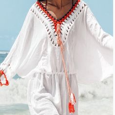 This Cupshe V-Neckline Coverup Is Just What You Need For Those Beach Days. This Coverup Is Lightweight And Airy. It Has This Great Crochet Detailing That Makes It Whimsical But Very Stylish. The Crochet Neckline Colors Are Orange, White, Peach, And Navy. The Crochet Borders Of Each Sleeve Are Orange, White, And Peach Crochet. It Also Comes With A Peach Crochet Belt With 2 White & Peach Tassels That Adds Another Great Detail To This Coverup. The V-Neckline Allows You To Cover Both Shoulders Or Just One Shoulder. The Crochet Belt Can Be Worn With The Coverup Or Without. The Waistline Has Elastic So It Does Expand. The Actual Name Of This Coverup Is Tunique Blanche Avec Garniture Route. Beachy White V-neck Cover-up, White Cover-up For Brunch During Beach Season, Chic Long Sleeve Crochet Top For Beach, White V-neck Beach Top, Bohemian White V-neck Cover-up, Casual V-neck Festival Cover-up, White Crochet Top For Day Out, Chic White V-neck Cover-up, White Casual Festival Cover-up