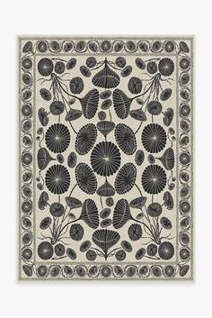 a black and white floral design on a beige background