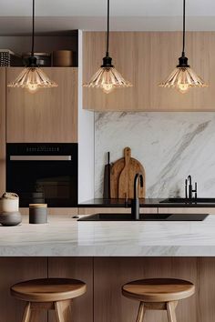 a kitchen with marble counter tops and wooden stools