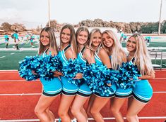 a group of cheerleaders posing for a photo