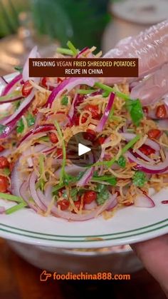 a person holding a plate with food on it and the caption reads reading veggie covered potatoes recipe china