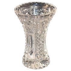 an ornate glass vase on a white background