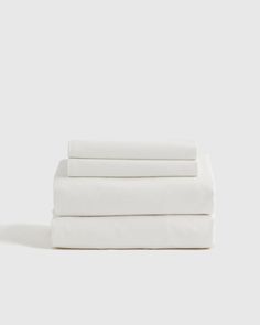 four white sheets folded on top of each other