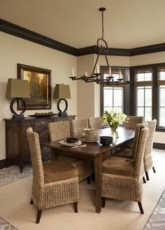 the dining room table is set with chairs and place settings for four people to sit at