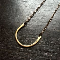 This simple necklace resembles a horse shoe and serves as a ring holder. I had a request from a massage therapist, she wanted a necklace that she could hang her wedding ring from so she could have her hands free. Great on it's own or with long layers! (RING IN PHOTO NOT INCLUDED) 1" wide, 16" sterling/ brass chain Available in 2 metals:- Silver - Brass Wedding Ring Necklace Holder, Zodiac Galaxy, Her Wedding Ring, Ring Holder Necklace, Turtle Pond, Galaxy Nebula, Ring Holder Wedding, Wedding Ring Necklaces, Necklace Holder