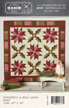 a quilted wall hanging next to a small table