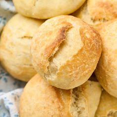 close up view of bread rolls on a blue and white cloth