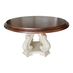 a wooden table sitting on top of a white base