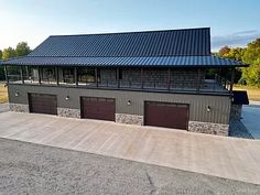 an aerial view of a building with three garages