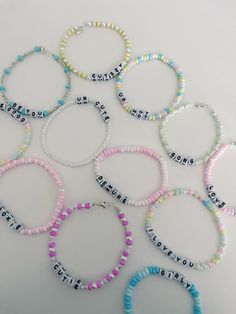 These adorable bracelets make amazing gifts for a sister, daughter, mother, or friend! You may purchase one of the pre made bracelets you see in the photos, of submit a custom name or phrase you want to customize the bracelet with! ♥️ Handmade with love and care ♥️ Adorable catchphrases   ♥️ Stretch elastic to fit all wrists ♥️ Light pastel colors to go with every outfit Available pre made bracelet's: "Pookie" "Be You" "Cutsey" "I Love You" "Love Urself" "Demure" "Ur Cute" "See the Good" Names To Put On Bracelets, Bracelet Names, Ur Cute, Bracelet Word, Made Bracelets, Bracelet Name, Bracelet Stacking, Daughter Mother, Amazing Gifts