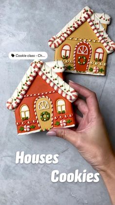 two gingerbread houses with candy canes on top and the words house cookies above them