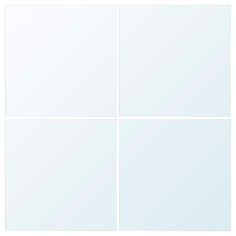 four square white tiles in different sizes and colors