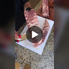 a person cutting up some meat on top of a counter