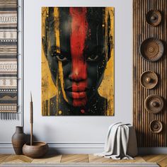 a painting on the wall of a living room with an african woman's face