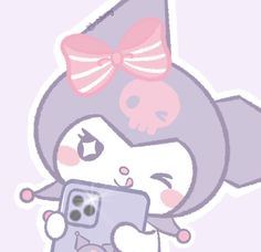 an animal with a bow holding a cell phone