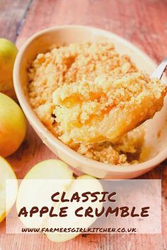 an apple crumble is in a bowl with some apples around it and the words, classic apple crumble